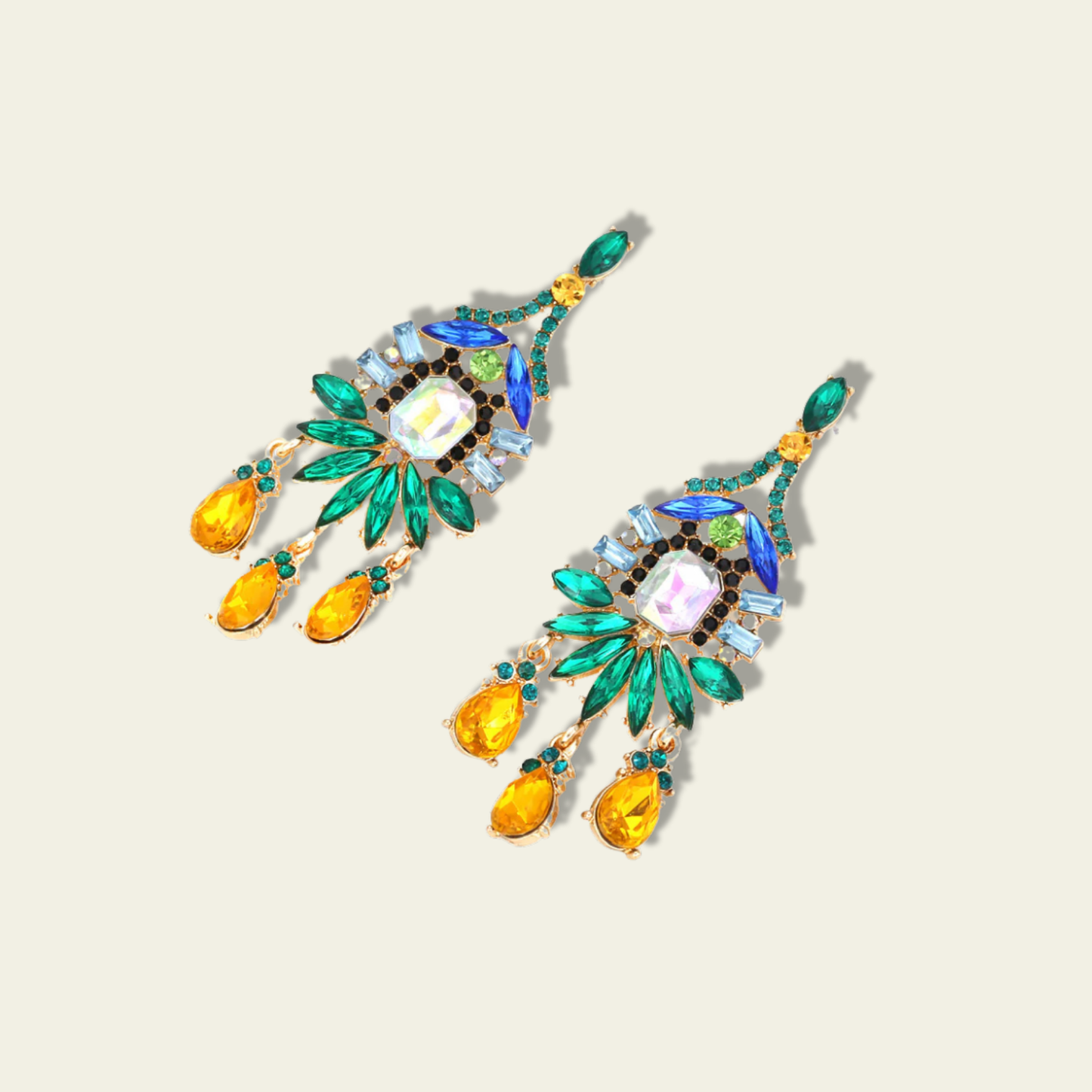 Fashion Chandelier Earrings from a different angle, as if laid flat. The multicolored stones in green, blue, and yellow are clearly visible, showcasing their intricate arrangement in a cascading pattern. From this perspective, you can see how the stones are layered and the fluidity of their design. The earrings maintain their elegance even in a relaxed position, emphasizing their refined and sophisticated look.