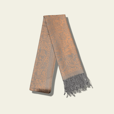 This luxurious rose jacquard shawl features intricate woven patterns, giving it a timeless, sophisticated appearance. The delicate weave and rich texture of the fabric are designed to stand the test of time, offering both warmth and style.