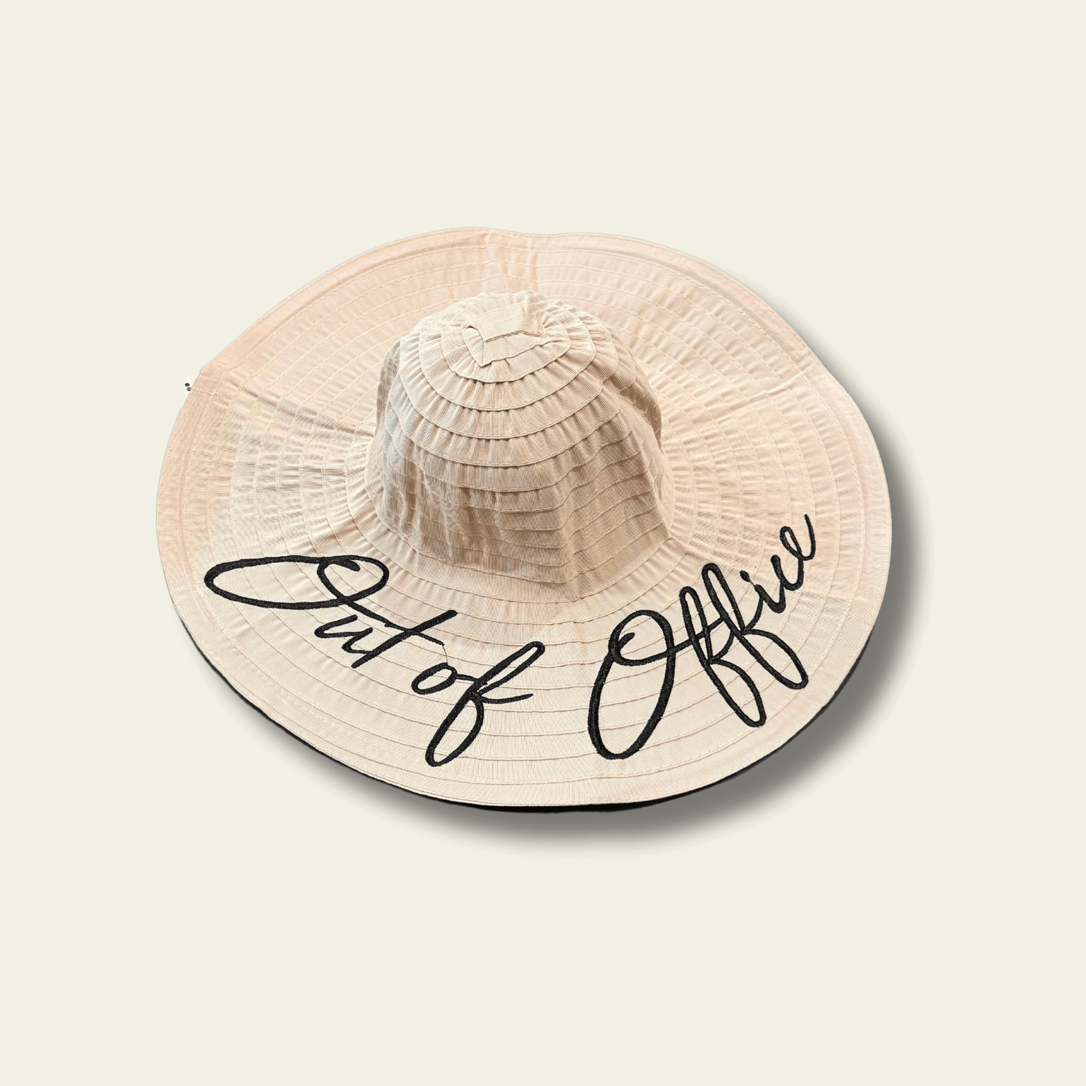 This beige crushable hat features the playful and bold "Out of Office" quote printed on the front, making it the perfect accessory for those times when you’re ready to unwind. The hat is made from soft, flexible material that can easily be folded or packed without losing its shape, making it ideal for travel, weekend getaways, or relaxing days off.