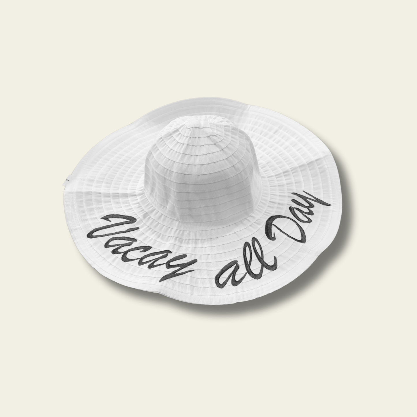 This white crushable hat features the fun and playful "Vacay all Day" quote printed on the front, making it the perfect accessory for your next vacation or relaxed day out. The hat is made from soft, flexible material that can be easily folded or packed without losing its shape, making it ideal for travel