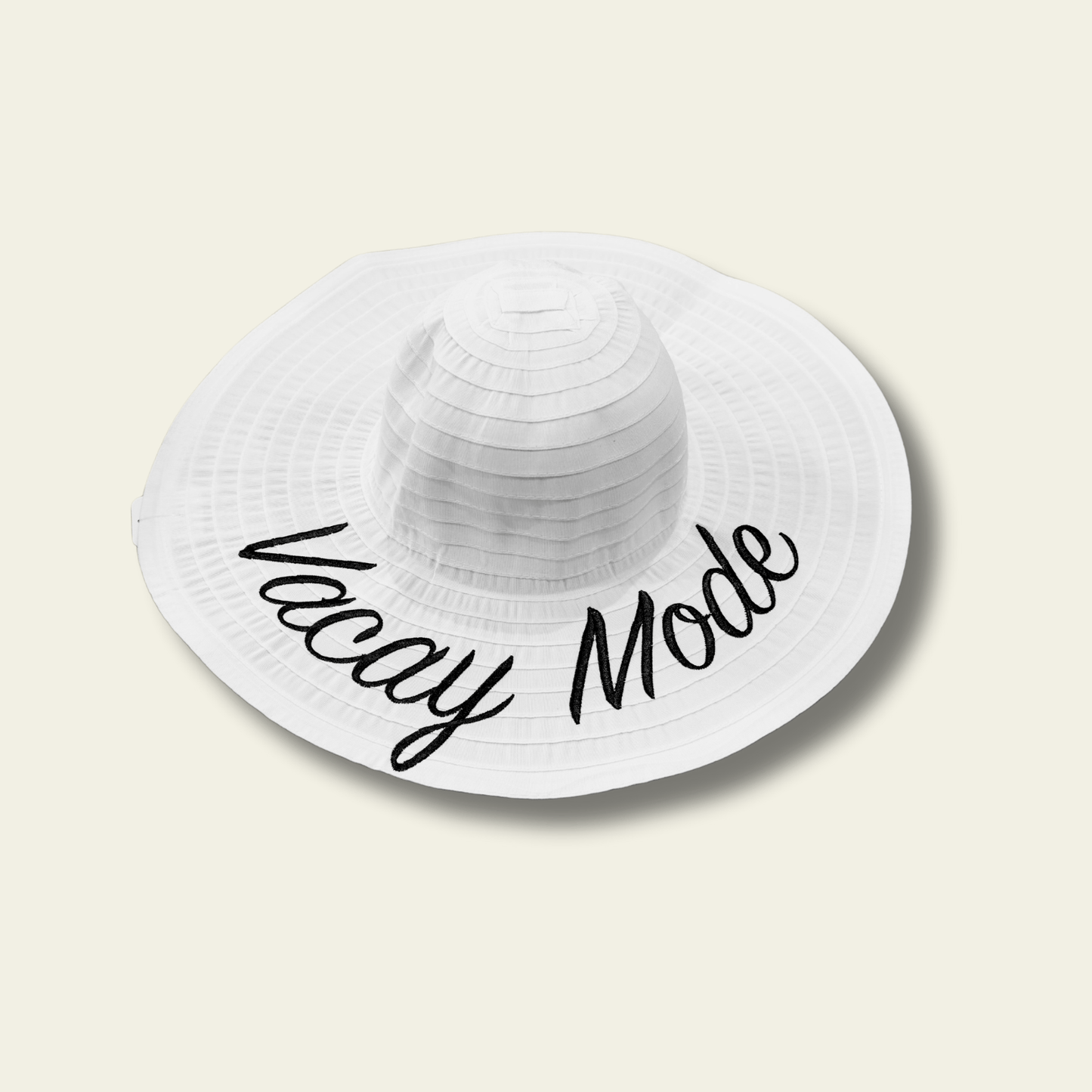 This white crushable hat features the fun and playful "Vacay Mode" quote printed on the front, making it the perfect accessory for your next vacation or relaxed day out. The hat is made from soft, flexible material that can be easily folded or packed without losing its shape, making it ideal for travel.