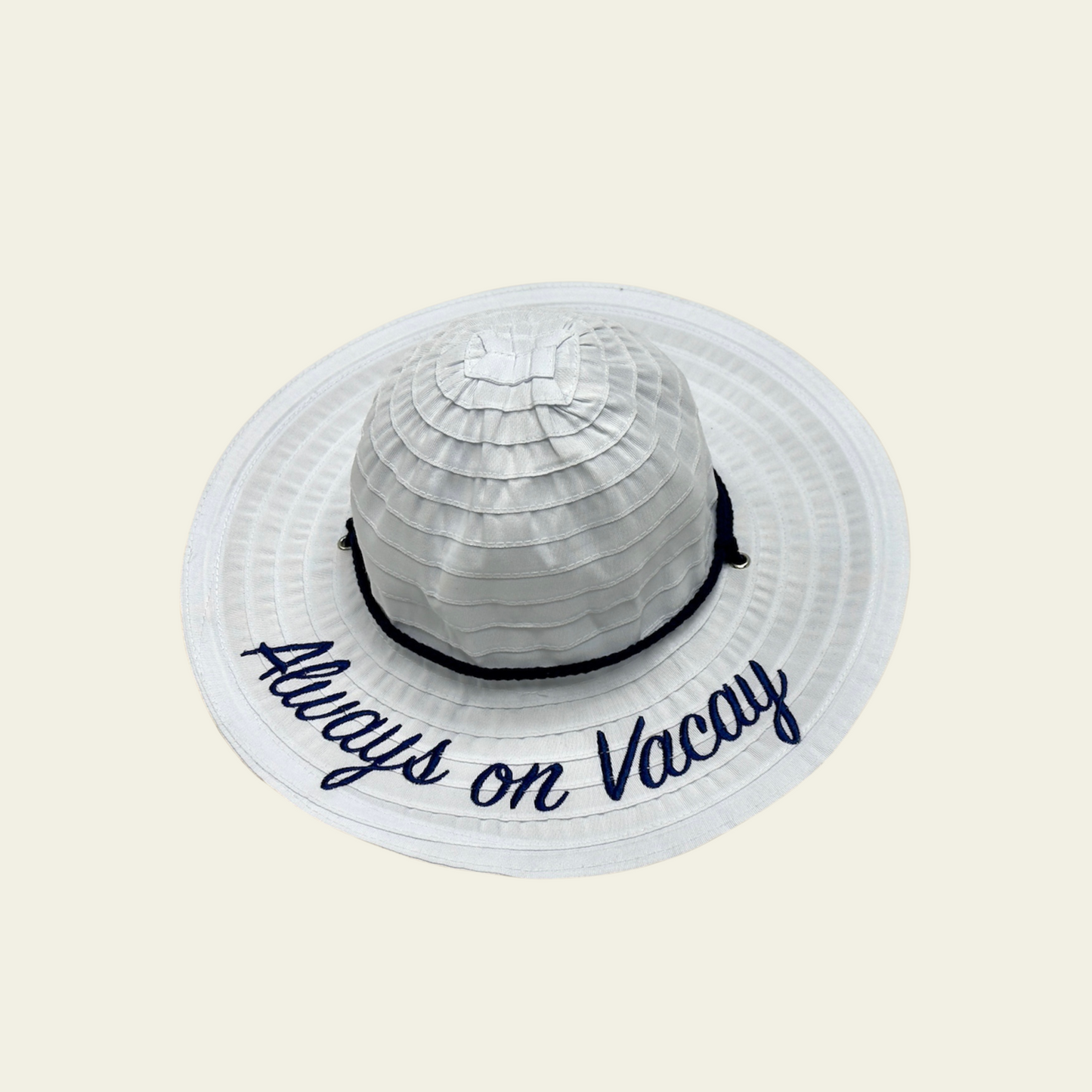 This kids' hat features a crushable white design, making it easy to pack and store when not in use. Made from lightweight, durable fabric, it is designed to provide comfort and sun protection. The hat features a printed quote "always on vacay" on the front, adding a fun and personal touch to your child's outdoor attire. Ideal for travel, beach trips, or casual wear, this hat can be easily packed without losing its shape.