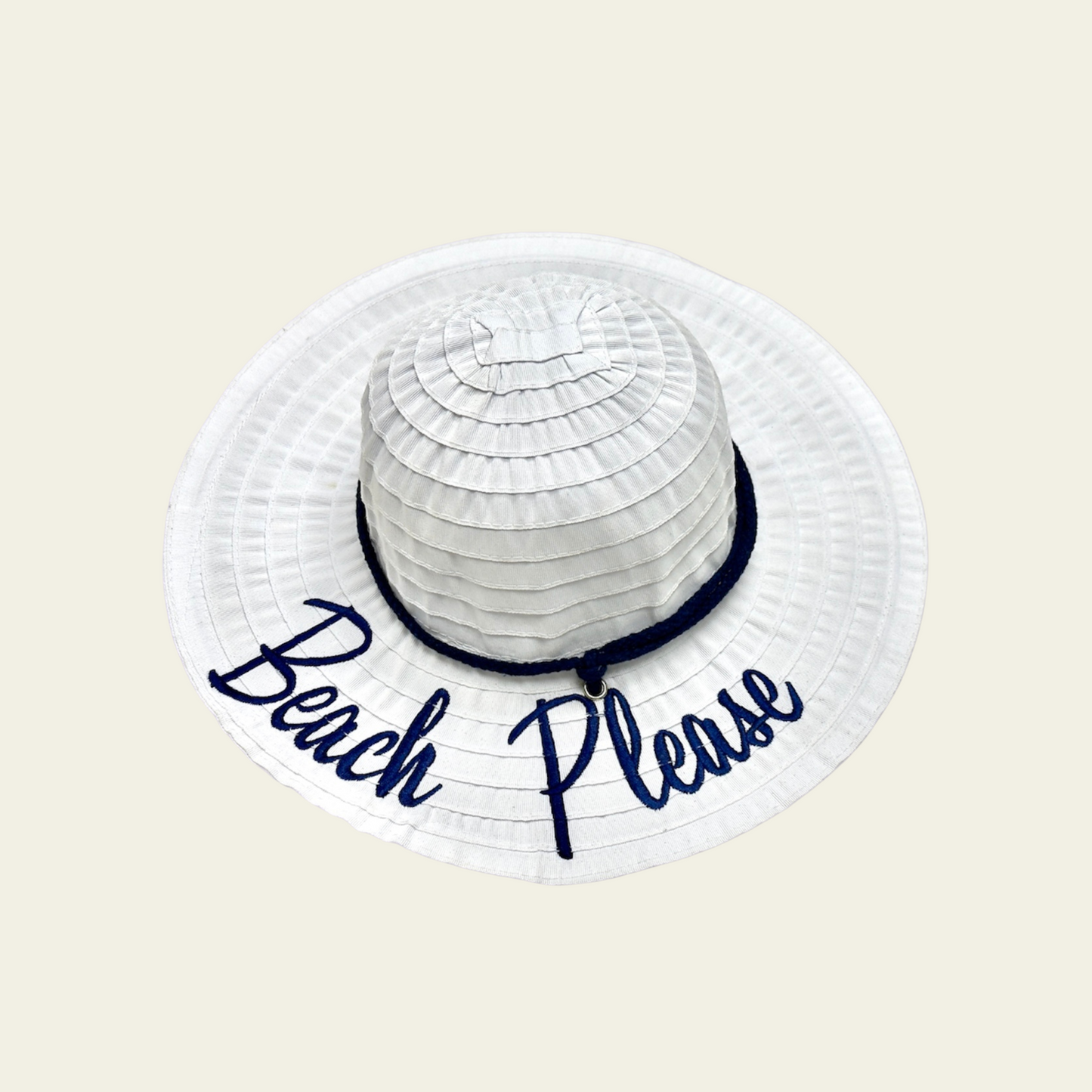 This kids' hat features a crushable white design, making it easy to pack and store when not in use. Made from lightweight, durable fabric, it is designed to provide comfort and sun protection. The hat features a printed quote on the front, adding a fun and personal touch to your child's outdoor attire. Ideal for travel, beach trips, or casual wear, this hat can be easily packed without losing its shape.