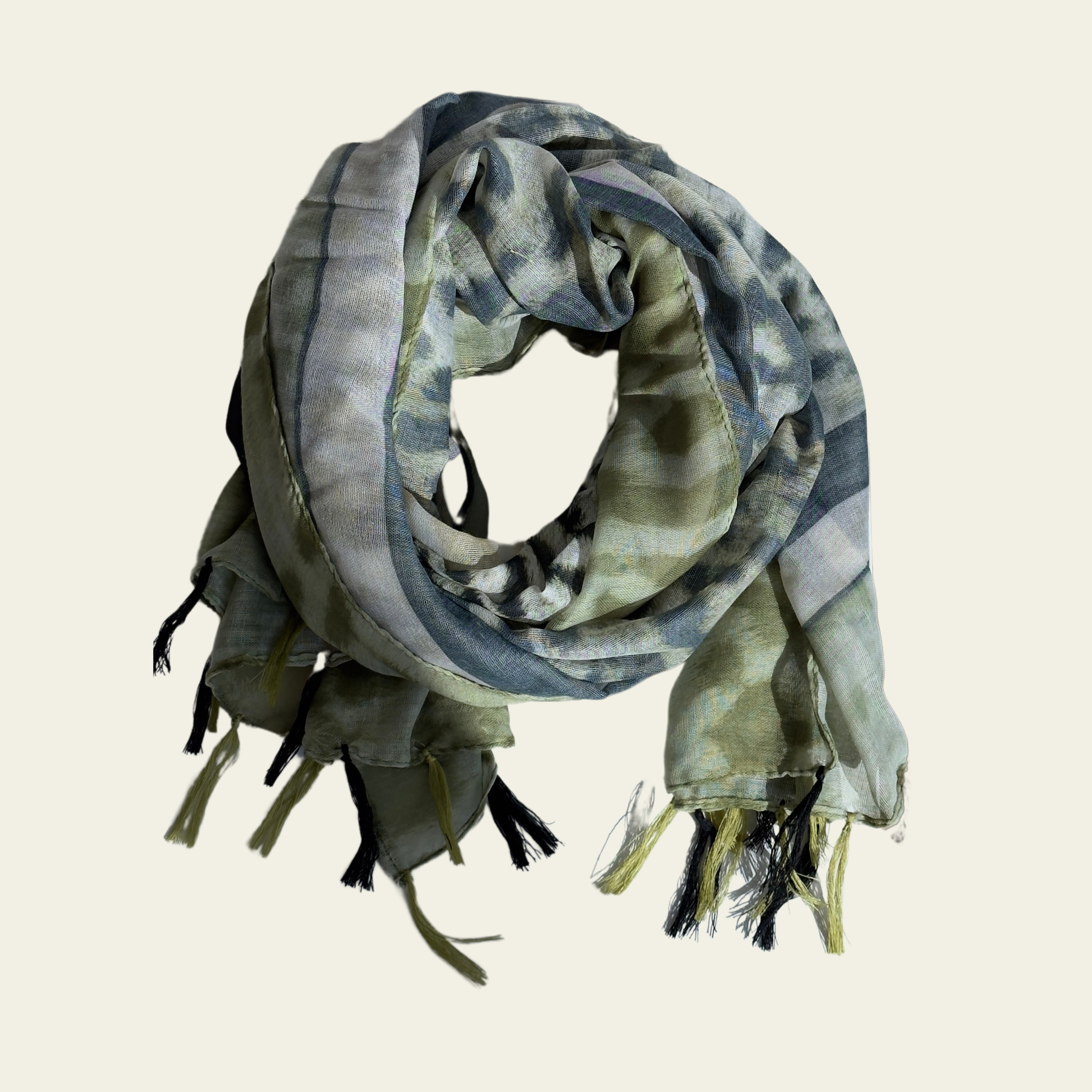 This green animal print scarf is displayed neatly rolled up, ready to be styled and draped around the neck. Its soft, lightweight fabric provides comfort while adding a touch of bold pattern to any outfit. The versatile design allows it to be worn in a variety of ways, making it a perfect accessory for both casual and semi-formal occasions.