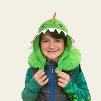 This adorable neck pillow with a hood for kids is designed to provide comfort and support during travel. Shaped like a cute green dinosaur, it offers a fun and cozy experience for children while they rest on long car rides, flights, or during naps. The soft and plush material ensures comfort, while the pillow’s ergonomic design helps support the neck for a more relaxed journey.