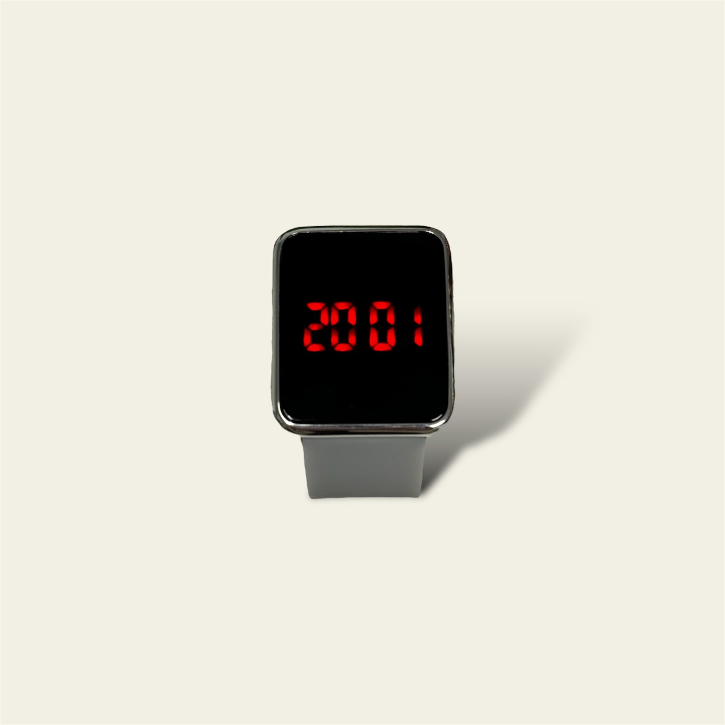 The LED Grey Watch with Silicone Band offers a modern and minimalist design, combining functionality with sleek style. The watch features a smooth black silicone band that ensures comfort and flexibility, making it ideal for everyday wear. Its LED display provides a unique, digital way to view the time, offering both practicality and a contemporary look.